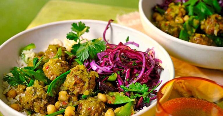 Meatballs & chickpeas yellow coconut curry with rice and inserted red cabbage